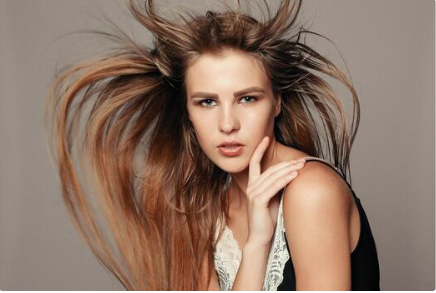 a ginger woman with sleek and flowing hair