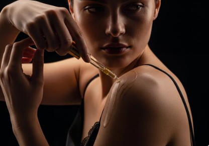 a sexy girl applying body oil, is body oil good before or after lotion