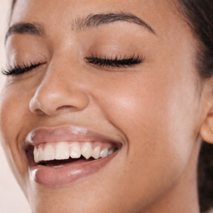 brown woman with curly, dense eye lashes, Say Goodbye to Eyelash Disappointment and Hello to Gravity-Defying Look, eyelash lift