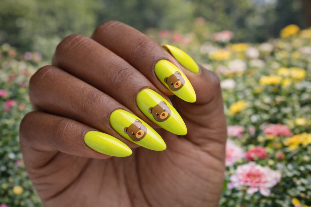 black woman with light green nail color with bears on nail tips
