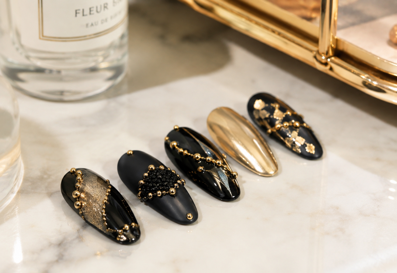 black and gold caviar nails